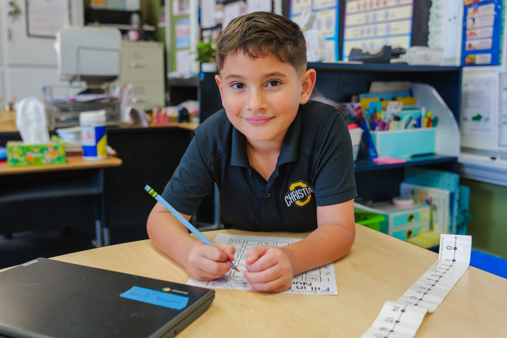 StudentSmilingStudyingInTheLearningCenter