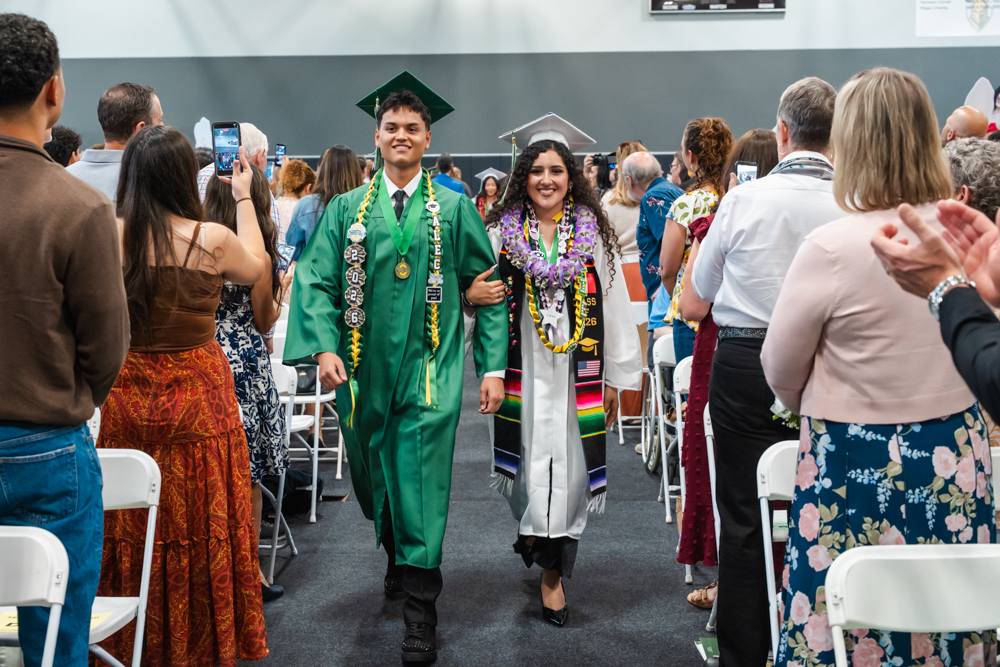 High School Graduation Students Joyfully Walking to the Stage.